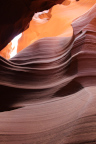 Photo of Antelope Canyon looking up at an undulating orange rock wall